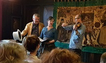 Jon Mee (far left) performing as Henry 'Orator' Hunt with the Alva duo (Vivien Ellis and Giles Lewin) at a crowded White Swan pub at the Festival of Ideas in June 2019